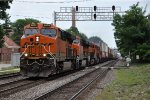 Westbound intermodal races down the middle track of the Racetrack